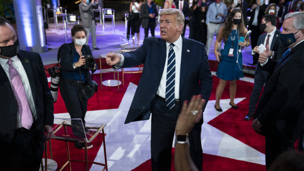 President Donald Trump talks with voters after his town hall in Miami.