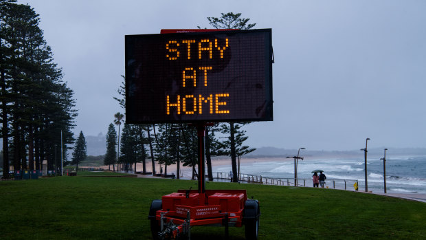 A COVID alert sign at Dee Why beach.