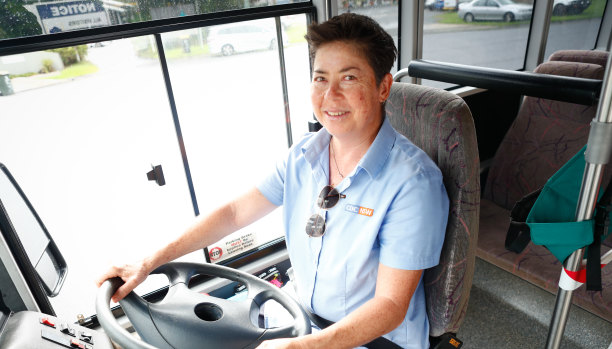 “I really love it”: Pauline Menczer at the wheel of the school bus she drives for a living. 