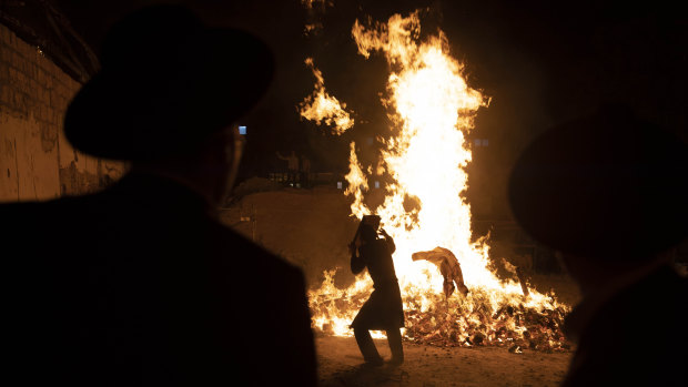 Ultra-Orthodox Jewish youths stand next to a bonfire in Jerusalem to mark the Lag B’Omer holiday, marking the end of a plague said to have decimated Jews during Roman times. 