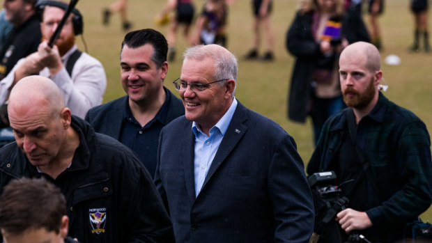 Michael Sukkar (back left) campaigning with Scott Morrison last week.