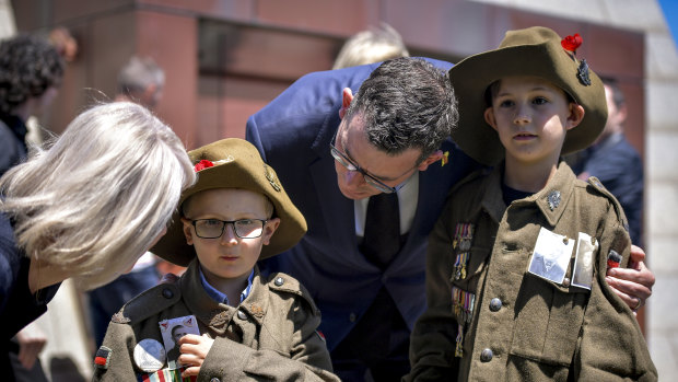 Remembrance Day: Premier Daniel Andrews and wife Catherine with Hayden 7 and brother, Riley 9 .