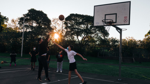 People playing basketball during lockdown in Tasker Park in Campsie.