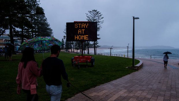 COVID ALERT sign displayed at Dee Why beach, asking people to stay at home after a Coronavirus COVID-19 Outbreak in Avalon on Sydney’s Northern Beaches over recent days. The Northern Beaches have been placed back into lockdown. 