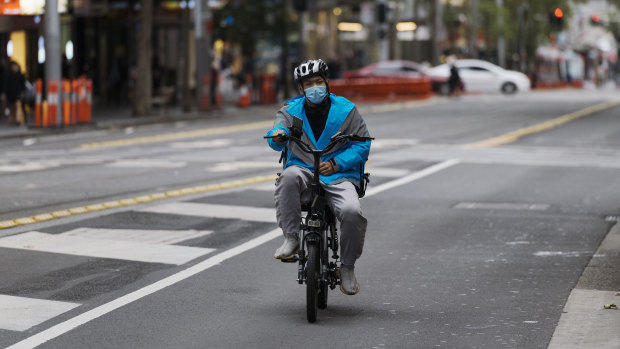 A food-delivery cyclist working during the coronavirus lockdown in Sydney's  CBD this week.