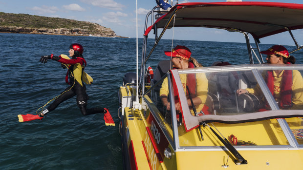 Surf Life Saving NSW's Randwick District Offshore Rescue Boat crew (radio call sign "Surf Rescue 30") at Malabar. Crew member Fiona Phelps jumps into the ocean as driver Nixy Krite and skipper Tresne Chesher remain on board. 