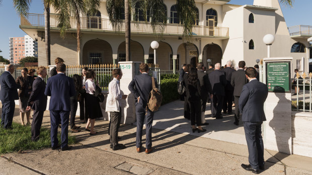 Members of the legal profession and Muslim community arrive at Auburn Gallipoli Mosque.