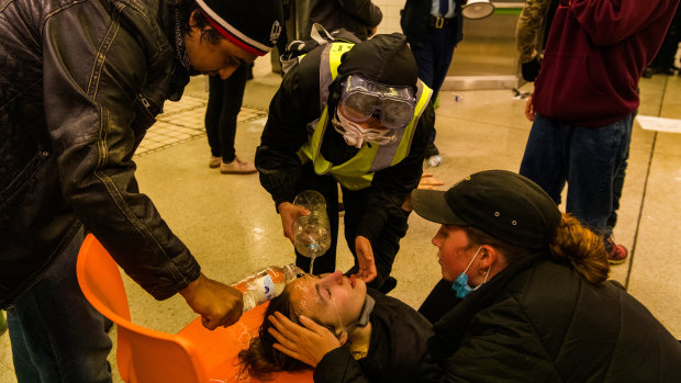 A woman is treated after being sprayed with capsicum spray at Central Station last weekend.