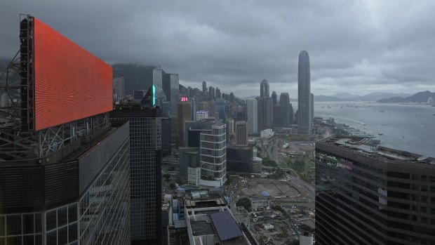 A red advertisement board is seen with backdrop of Hong Kong’s business district in Hong Kong on Monday.