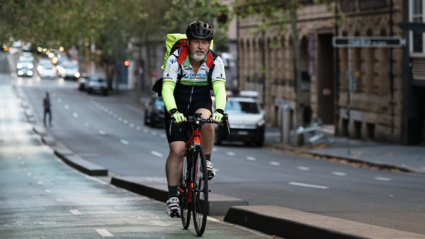 Heading through the city: Glenn Asquith who rides from Bass Hill to near the Queen Victoria building four days a week then home at night. 