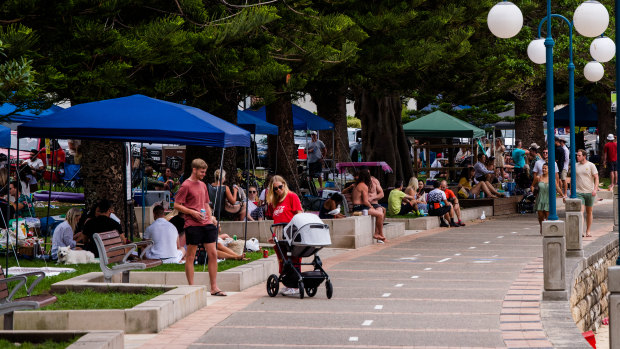 Groups gather in Manly on New Year's Eve. Experts won't know for days how the celebrations will affect the outbreak. 