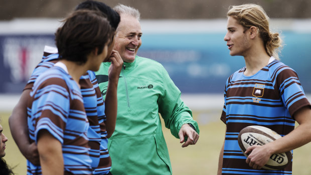 Happy to be back: David Campese shares some wisdom and a few laughs with players from the First XV at Sydney Boys' High