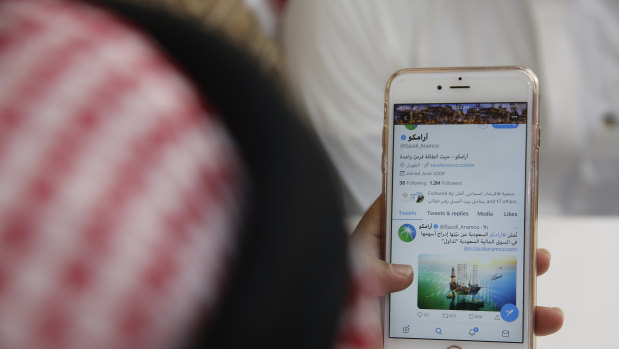 A man reading twitter in a coffee shop in Jiddah, Saudi Arabia.