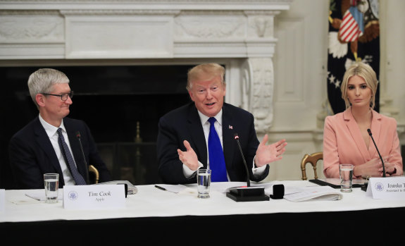 Tim "Apple" and the Trumps during their White House meeting on Wednesday.