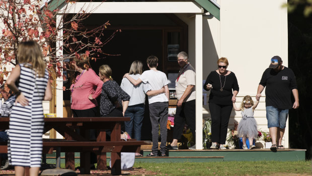Members of the Margaret River community leaving flowers at the community resource centre.
