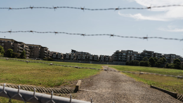 Centenary Park apartments overlook the former landfill site used by Ford motoring company. The fenced-off site was remediated in the 1990s. 