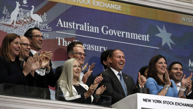 Josh Frydenberg gives a thumbs-up as he rings the opening bell of the New York Stock Exchange on Wednesday.