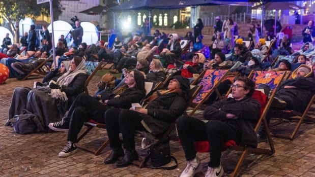 Crowds gather at Federation Square to watch the final episode of Neighbours.