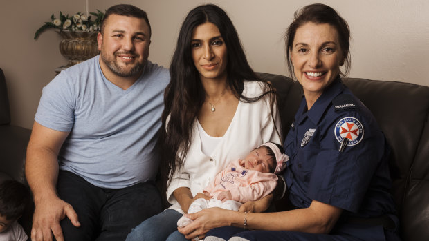 Paramedic Shani, with Hussam Ali, Thalia, and newly born Giselle.