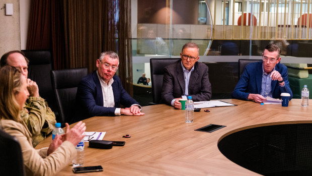 Government leaders receiving a briefing at the state emergency operations centre on Wednesday.