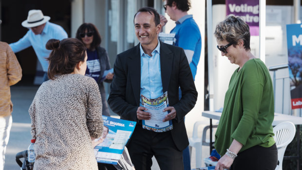 Dave Sharma and his wife Rachel at a pre-polling booth in Wentworth on Tuesday.
