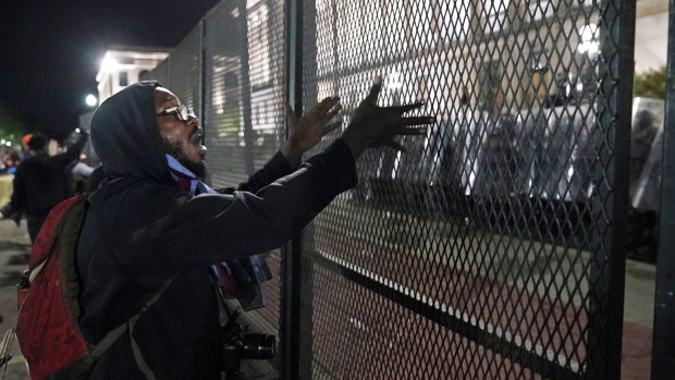 A protester shouts at police during clashes outside the Kenosha County Courthouse.