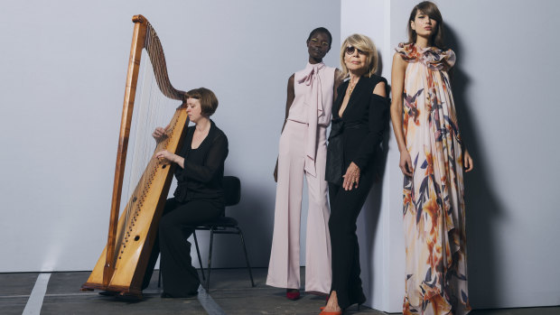 Deisgner Carla Zampatti (centre) with models Amer Athiu (left) and Roberta Pecoraro, and harpist Hannah Lane from the Australian Brandenburg Orchestra ahead of Zampatti's show at Mercedes-Benz Fashion Week Australia on Thursday.