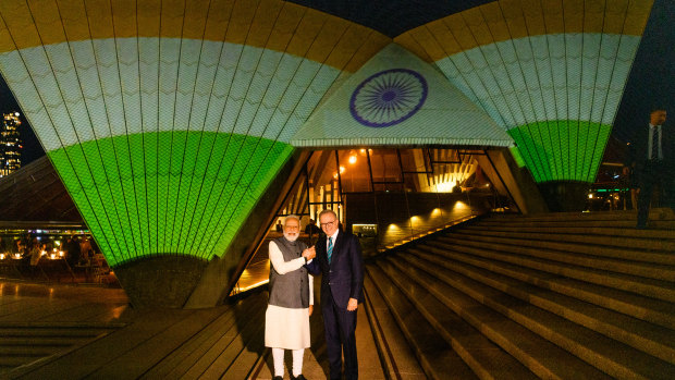 Narendra Modi and Anthony Albanese outside the Opera House with the sails lit up with the Indian flag.