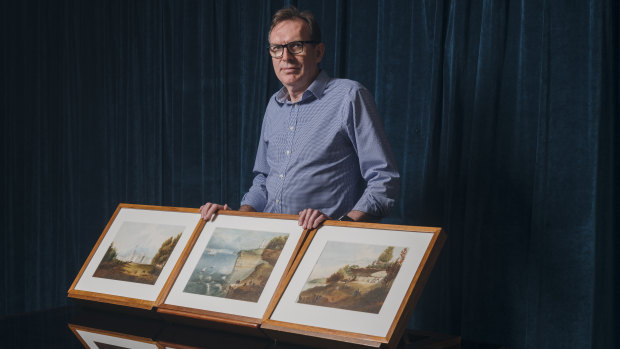 Richard Neville, Mitchell librarian, with a collection of rare watercolours from the 1850s that the library has purchased.