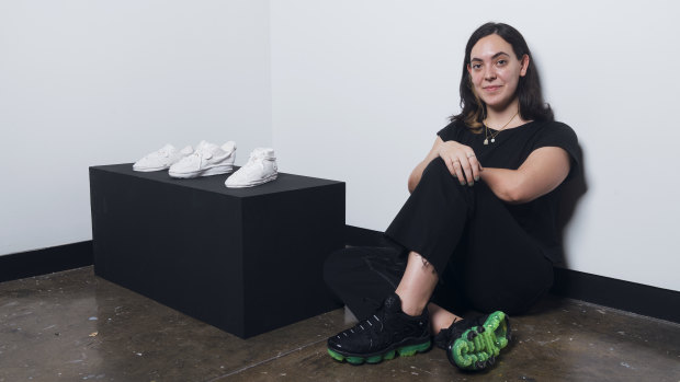 Artist Gillian Kayrooz with her ceramic sneakers. 