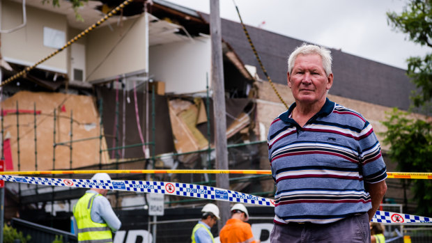 Financial planner Tom Roche outside the wreckage of the building he has worked in for almost 20 years.