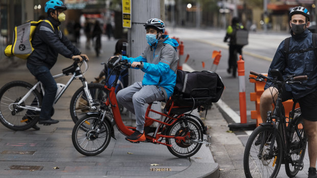 Food delivery cyclists working during the coronavirus isolation lockdown in the Sydney CBD.