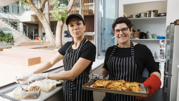 Karin Von Specht, right, and Nina Wilson serve healthy food at the St Mary's Primary School Canteen in North Sydney. 