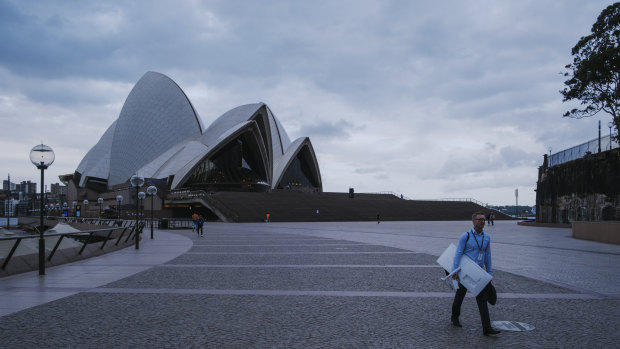 An empty Circular Quay: data from Apple and Google shows Sydneysiders are locking themselves down, with foot traffic and public transport use still significantly below baseline levels.