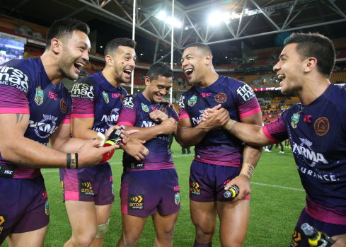 Giddy up: Broncos players celebrate their crucial win against Souths on Thursday night.