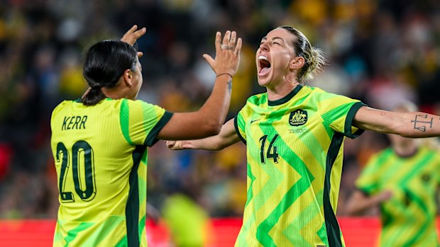 Alanna Kennedy celebrates with Sam Kerr after scoring against New Zealand in December.