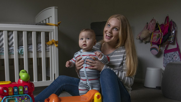 Au pair Erika Palsson looks after nine month old Jayden while his mother works from home.
