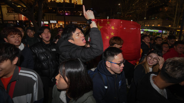 A number of pro-China demonstrators at a pro-Hong rally at Melbourne State Library.