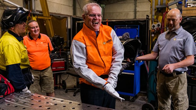 Welding for the cameras at a visit to Opie Manufacturing in Emu Plains. He burnt his finger during the “photo  opportunity”.