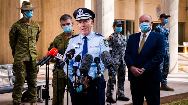 NSW Police Commissioner Mick Fuller, Police and Emergency Services Minister David Elliott and national commander of Operation COVID-19 Brigadier Mick Garraway address the media about the deployment of ADF officers across Greater Sydney as part of the Delta outbreak response in August 2021.