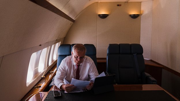 Work to be done: Morrison on board a RAAF Boeing 737 from Sydney to Brisbane.