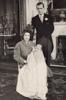 HRH Princess Elizabeth and Prince Philip with the infant Prince Charles at his christening at Buckingham Palace, 15 December 1948. 