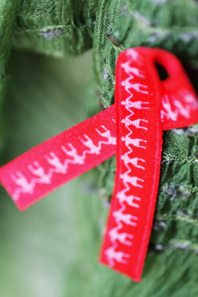 The red ribbon has been associated with AIDS-HIV support for decades.