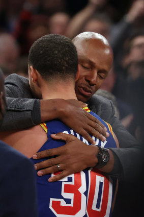 Steph Curry hugs Ray Allen, after surpassing Allen’s record for NBA career three-pointers.
