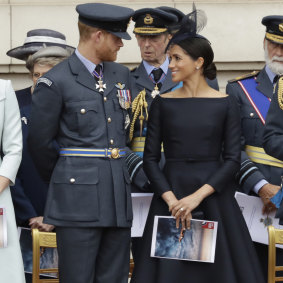 Markle wearing a Dior gown at a ceremony before the flypast of Royal Air Force aircraft.