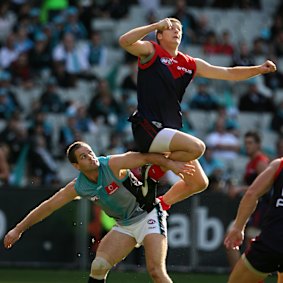 Ricky Petterd leaps for the ball.