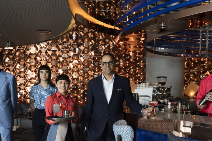 Marriott boss Rajeev Menon with staff in W Sydney’s Living Room bar.
