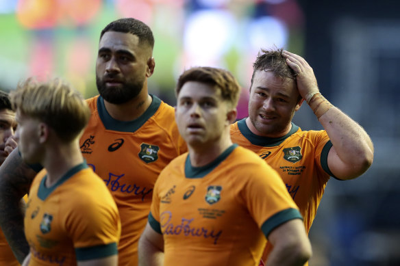 Wallabies captain Harry Wilson and teammates react after the defeat.