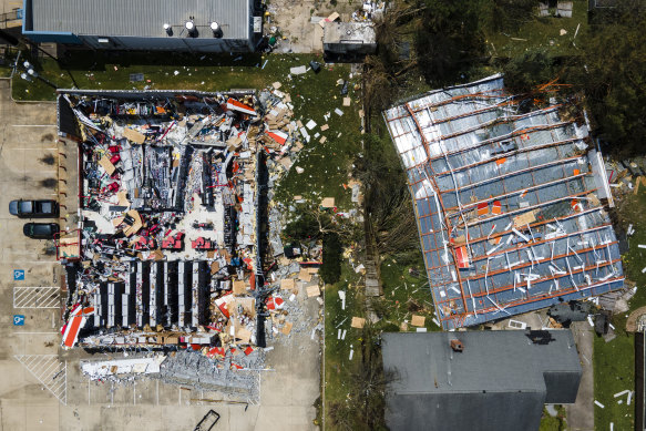 A drone photo shows the roof blown off of an AutoZone store in Lake Charles.