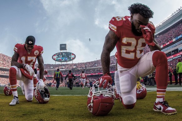 Kansas City Chiefs players pray before a game against the Tennessee Titans in January. 